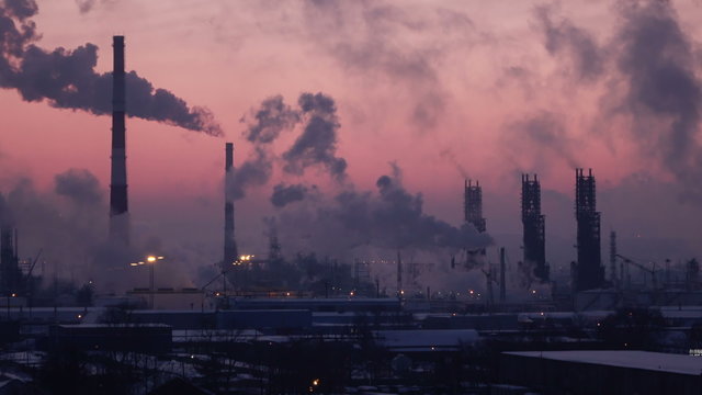 Timelapse Video of Oil Refinery Air Polution at Sunset. 4K  video.
