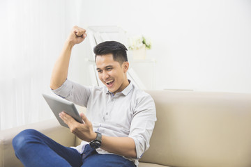 happy young man raise his hand. success