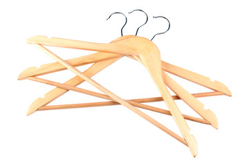 many wooden hangers on white isolated background