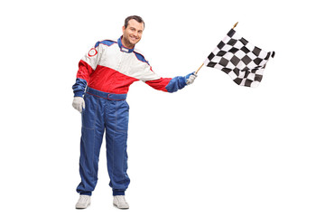 Young man waving a checkered race flag