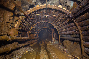 underground abandoned gold mine ore tunnel with rails Berezovsky mine Ural
