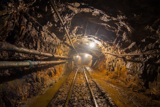underground abandoned gold mine ore tunnel with rails Berezovsky mine Ural