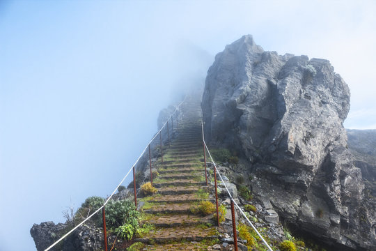 mountain trail in Madeira above the clouds on a sunny bright afternoon