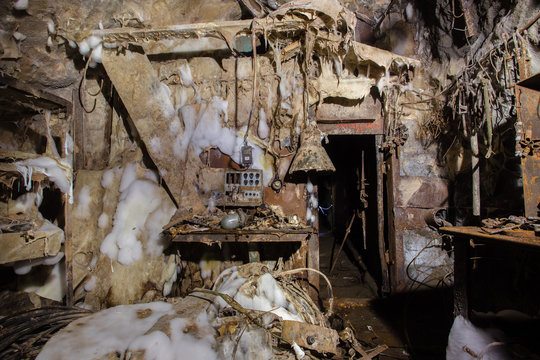 Old abandoned underground iron mine mechanic workshop with mold