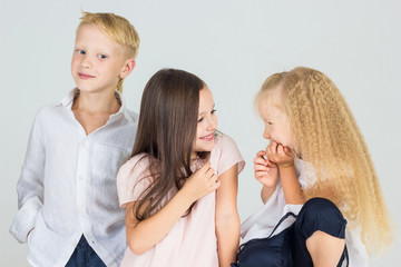 Children play and smile in studio