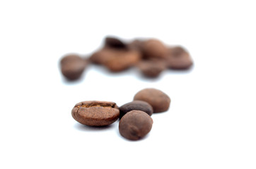 Roasted coffee beans on white background