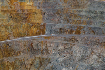 Old abandoned gold mine tunnel passage with yellow sulfur dirt