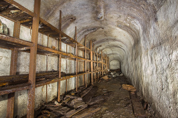 Fototapeta na wymiar Old abandoned underground iron mine bunker mechanic workshop