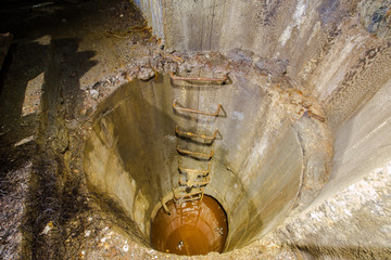 Old underground abandoned iron mine pumping station sump