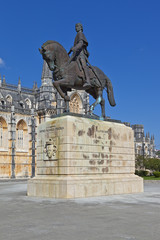 Naklejka premium Batalha, Portugal - March, 2015: Batalha Monastery. Nuno Alvares Pereira statue. One of Portugal most important national heroes. Medieval noble and knight. Portugal. UNESCO World Heritage Site.