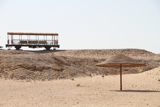 parasol and a wagon in the Egyptian desert