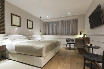 Modern double bed hotel bedroom interior