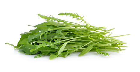 Sweet rucola salad or rocket lettuce leaves isolated on white ba