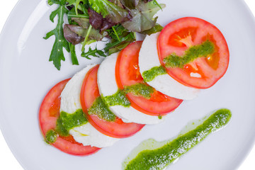 Fresh salad with tomatoes, mozzarella and arugula