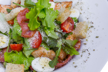 Caesar salad with chicken and quail eggs