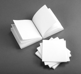 Collection of white note papers on gray background.