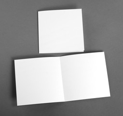 White empty  card on grey to replace your design.