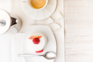 White cake with raspberry and coffee