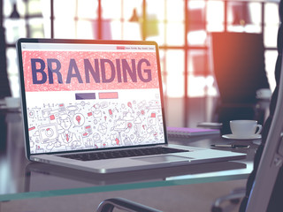 Branding - Closeup Landing Page in Doodle Design Style on Laptop Screen. On Background of Comfortable Working Place in Modern Office. Toned, Blurred Image. 3D Render.