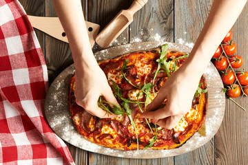 Home made pizza on wooden table