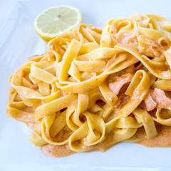 pasta with salmon on a the table