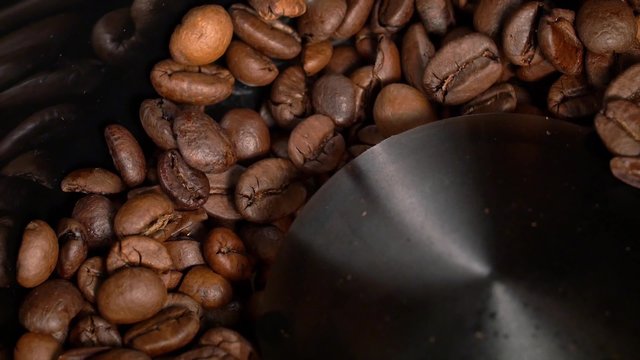 Close-up of coffee grinder grinding coffee beans