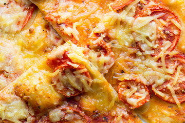 Pizza with ham, pepper and olives.