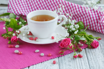Cup of tea and roses