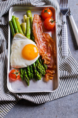 Green asparagus with fried eggs