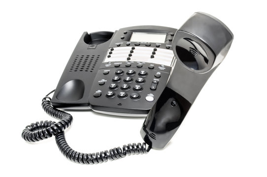 Business Telephone Off The Hook on a White Background