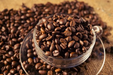 Roasted coffee beans on sackcloth warm tone