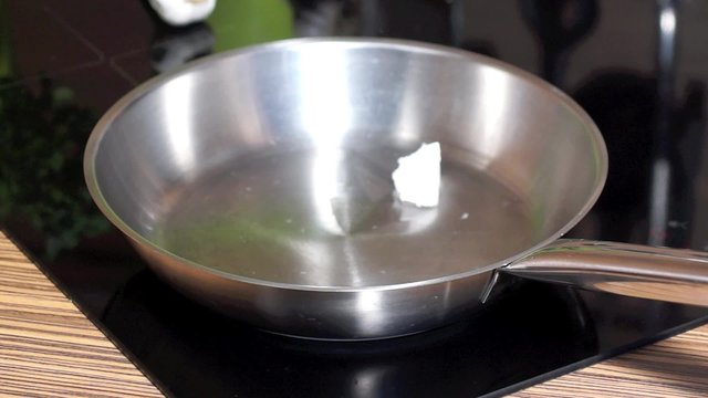 Melting coconut oil in  pan
