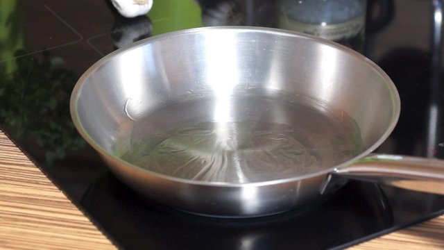 Melting coconut oil in  pan