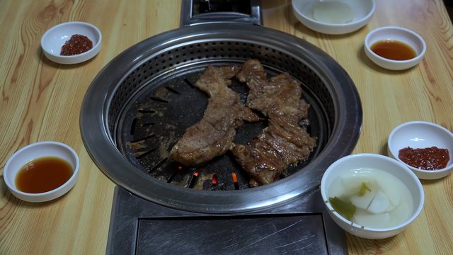 Side dishes served with Bulgogi (Korean barbecue) in a restaurant. Seoul
