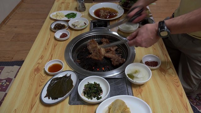 Bulgogi (Korean barbecue) self cooking in a restaurant. Seoul
