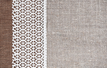 Vintage background with rude fabric and lace on burlap