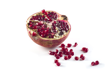 Ripe cut pomegranate isolated on white