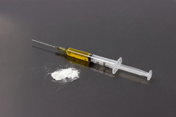 Drug syringe and cooked heroin