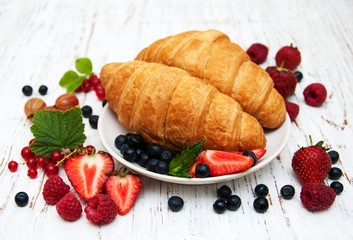 Fresh berries and croissants