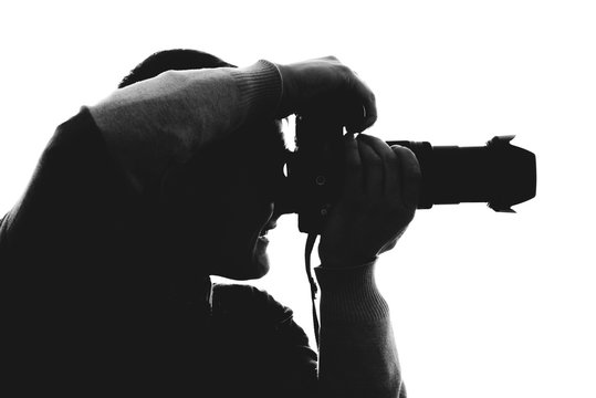 Photographer silhouette isolated on white background