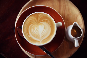 Hot Latte Coffee in coffee shop on table wooden