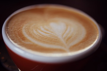 Hot Latte Coffee in coffee shop on table wooden