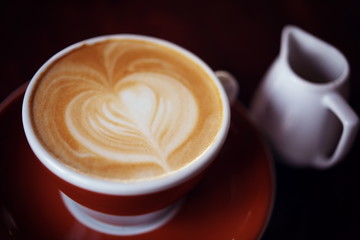 Hot Latte Coffee in coffee shop on table wooden