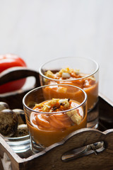 salmorejo in crystal glasses, in a wooden tray