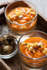 salmorejo in crystal glasses, in a wooden tray