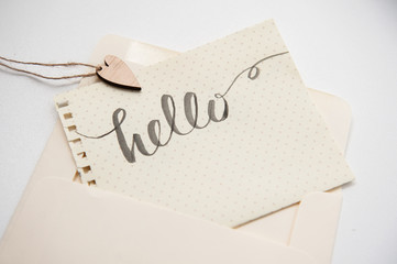 calligraphic inscription hello and heart for greating card