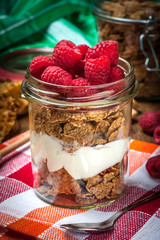 Muesli with yogurt and raspberries.
