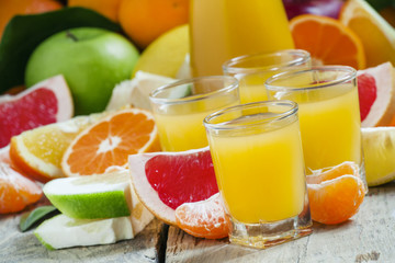 Citrus, cocktail jug, pieces of fruit on a dark background, sele
