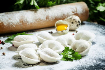 Traditional Russian dumplings with minced meat on the table with