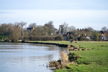 Ditton Meadows, a common alongside the River Cam. The Cambridgeshire village of Fen Ditton, the tower of the St Mary the Virgin Parish Church dominant, is in the background.